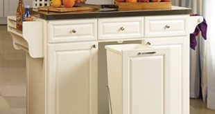 White Kitchen Cart With Trash Pull $279.99. Use for my folding center/extra  storage in the bathroom. Pull out as a hamper.