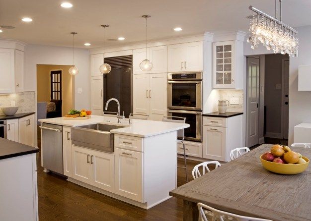 kitchen island with sink and dishwasher and seating