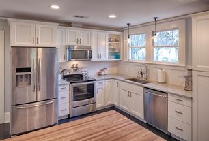 Traditional Kitchen with Subway Tile, L-shaped, Pendant light, Complex  granite counters, Flat panel cabinets, Crown molding