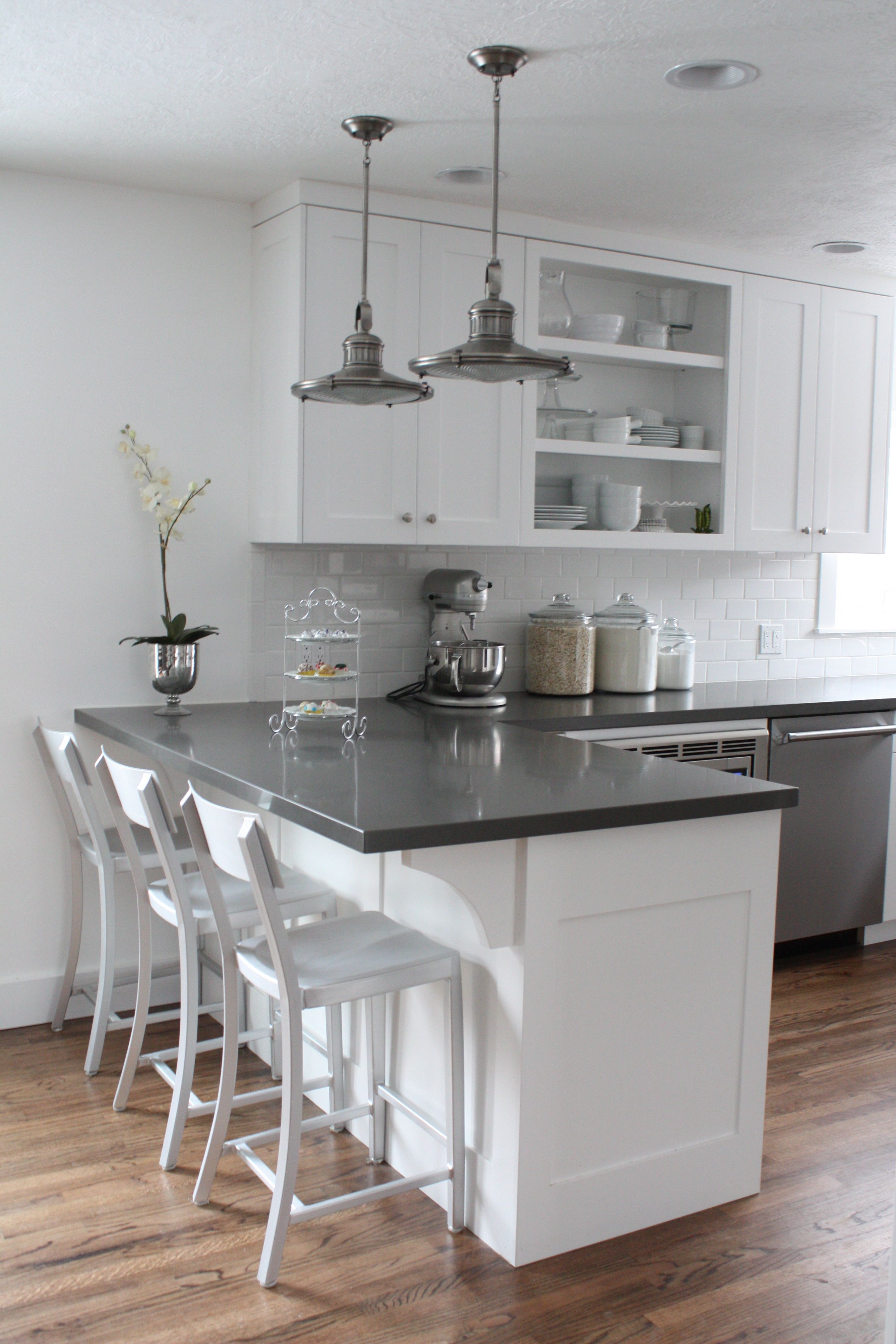 White cabinets, subway tile, quartz countertops