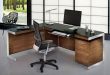 Keyboard tray and L-shaped desk = very nice. A little too modern/masculine  for me.