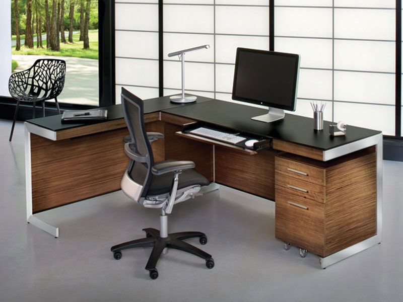 Keyboard tray and L-shaped desk = very nice. A little too modern/masculine  for me.