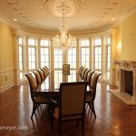High end mahogany dining table in NJ estate shown with regency style chairs