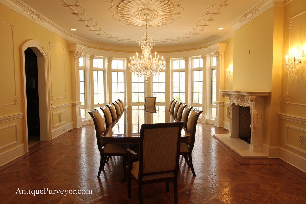 High end mahogany dining table in NJ estate shown with regency style chairs