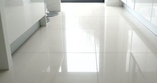 large white kitchen floor tiles. We put shiny white tiles in our bathroom  and they always look great - and are actually easy to keep clean.