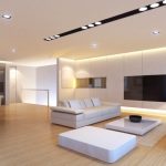 Here is a bright and simple modern living room that uses a number of simple  recessed