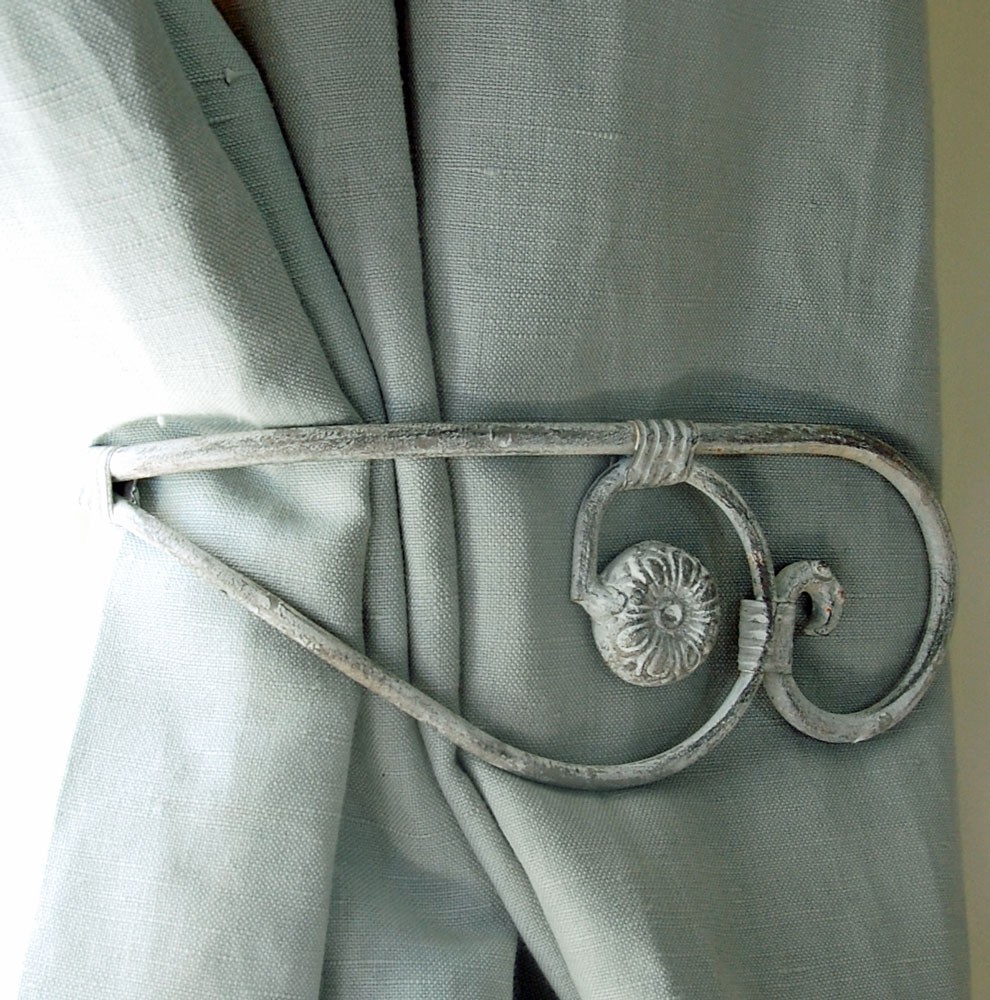 Wise use of decorative metal curtain tie
  backs