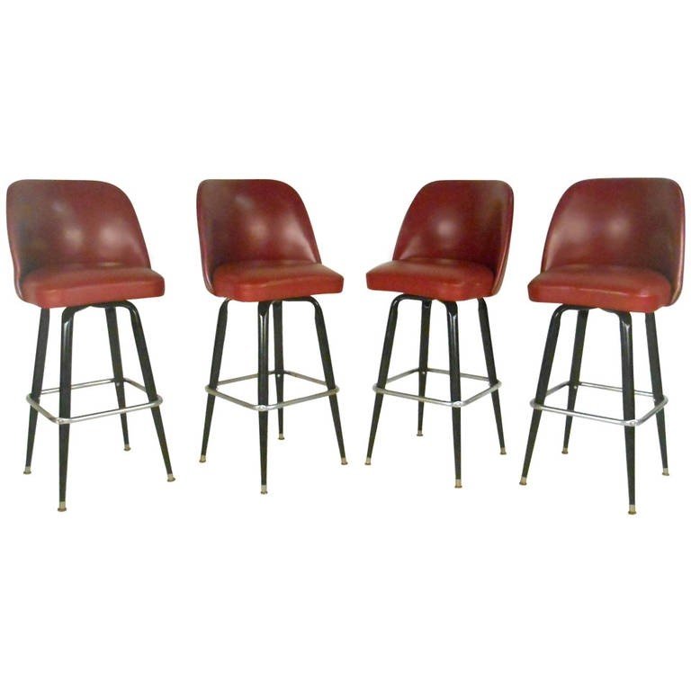 Italian designer bar stools. Set of Four Mid-Century Swivel