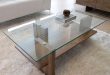 A great example of a modern glass/wood coffee table. The design is  streamlined, allowing the quality of the materials used to shine through.