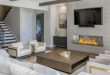 Example of a huge minimalist open concept medium tone wood floor and brown  floor living room