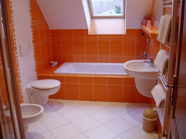 A tall bathroom cabinet used as a room divider, modern bathroom design