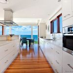 Modern white kitchen wood floor - lisaasmith.com