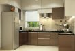 U shaped kitchen with modern cabinets and false ceiling