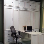 Murphy bed shown with the desk folded out.