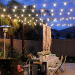 Festoon lights strung across a yard |52 Spectacular outdoor string lights  to illuminate your patio