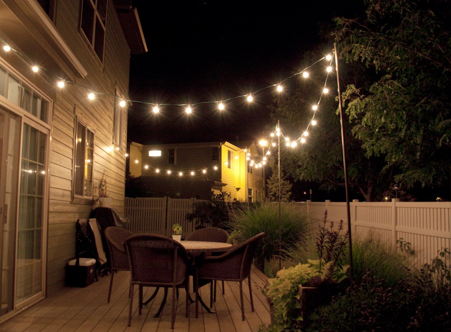 How to make inexpensive poles to hang string lights on - café style! Via  Bright July