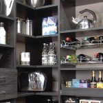 Custom kitchen organization system in gray with drawers, baskets and tray  organizer