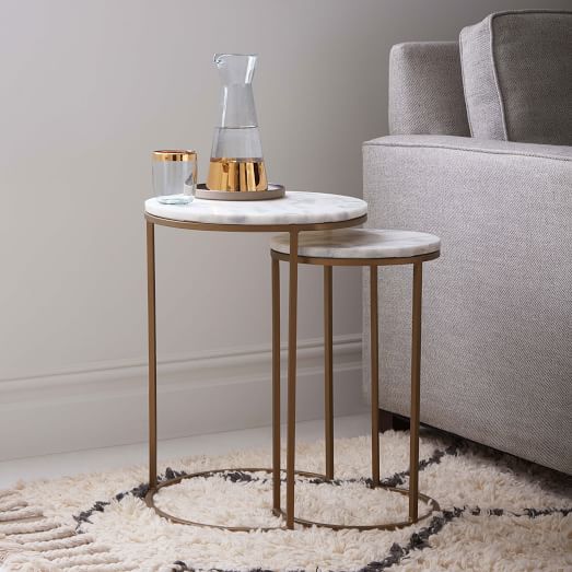 Accessorize your home with round nesting
tables marble top