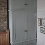 Traditional shaker style painted wardrobes built to fit snuggly in an  alcove of a period style house.