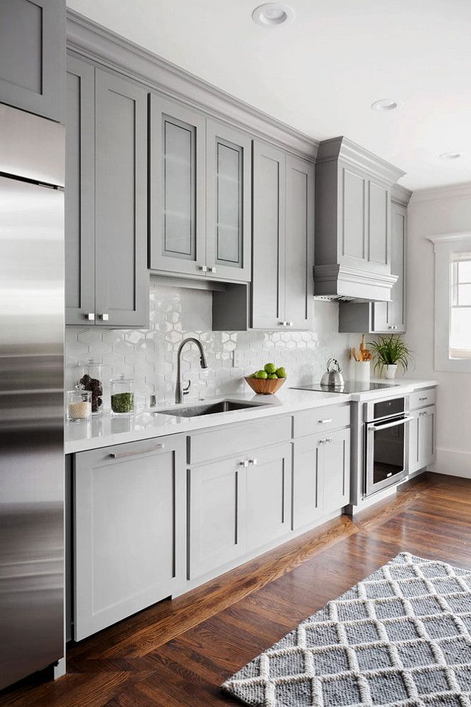 Backsplash Light grey Shaker style kitchen cabinet painted in Benjamin  Moore 1475 Graystone. The walls are Benjamin Moore Dove Wing.