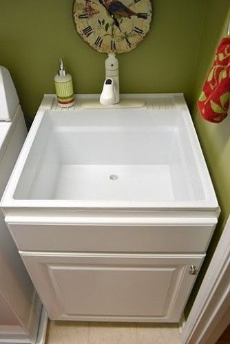 Less pricey sink disguised Build a cabinet box around utility sink
