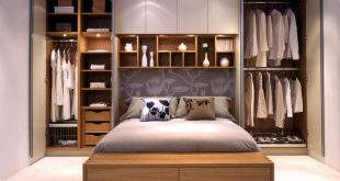 Bedroom Storage Ideas - wardrobes on either side of the bed, and with long  white curtains covering