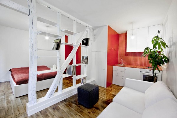 Surprisingly Small Apartment in Paris with a Charming Red and White Interior  Shop this look: ottoman, couch, comforter.