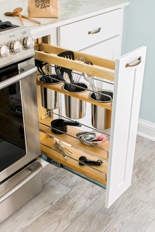 Get the most out of a narrow space with a pull-out cabinet, like this one  from Home Depot.