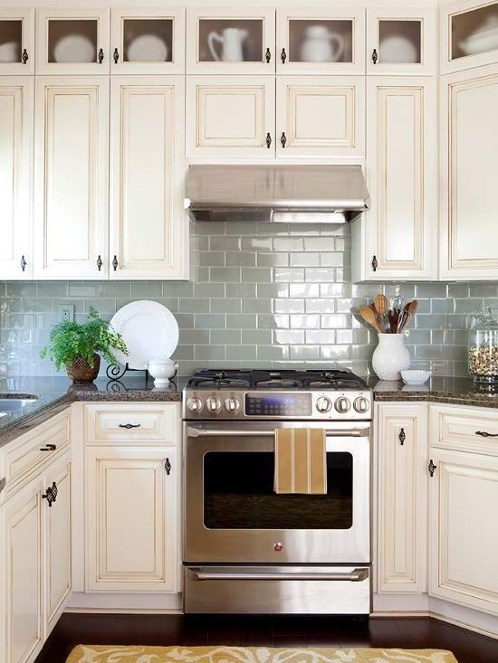 Do you have a small kitchen space? Try adding glass shimmering tiles to  open the space up.