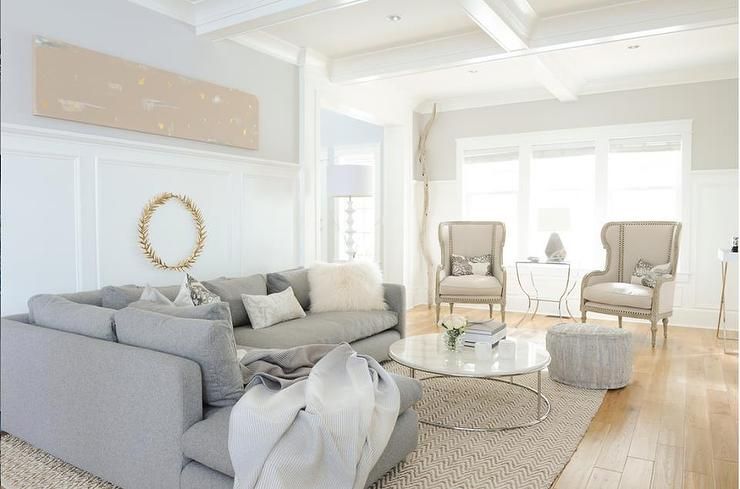 Gray sectional with CB2 Smart Round Marble Top Coffee Table