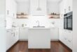 Timeless Elegance: The Perfect Harmony of White Cabinets and Dark Wood Floors